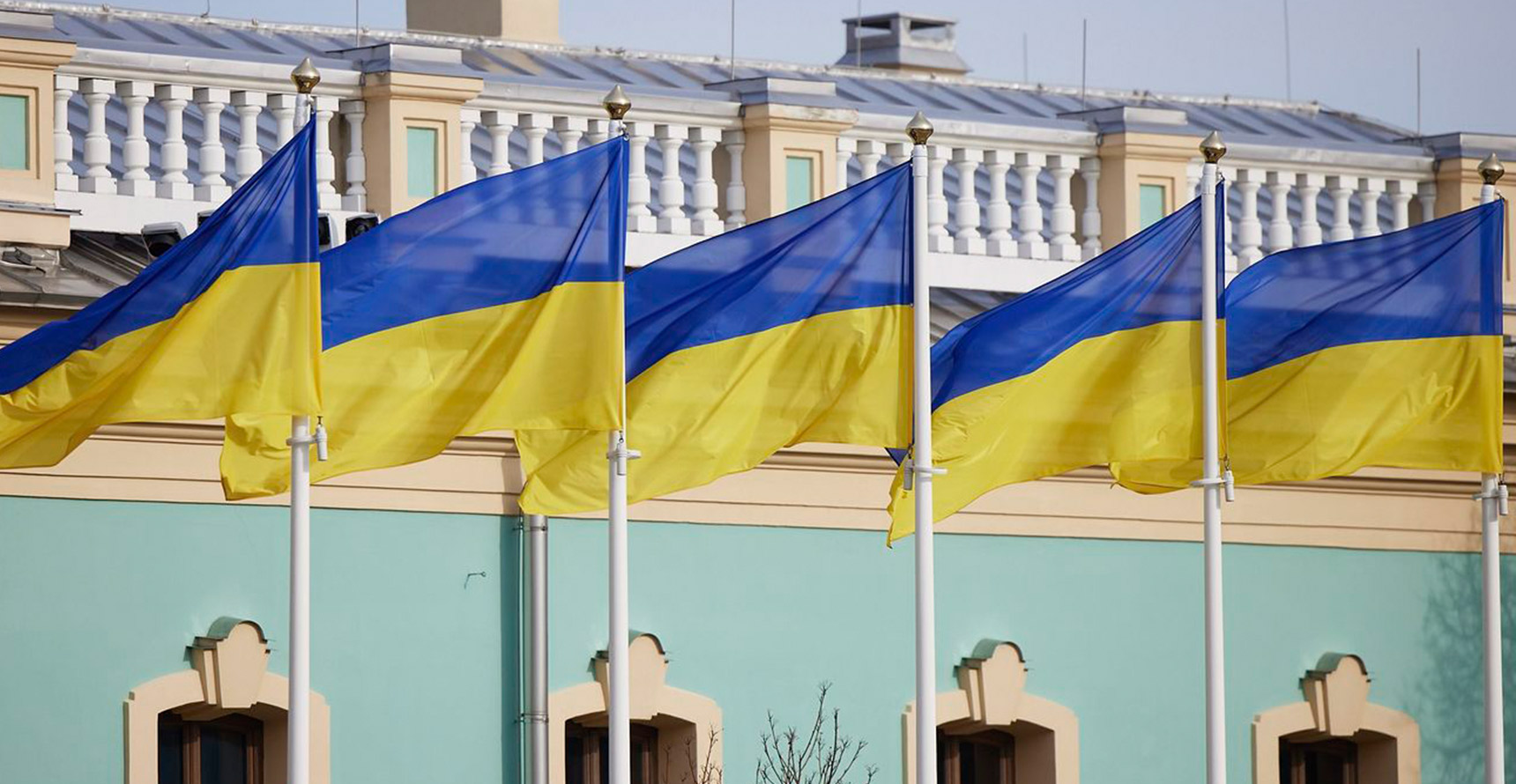 Close-up photo of five Ukrainian flags flying side by side
